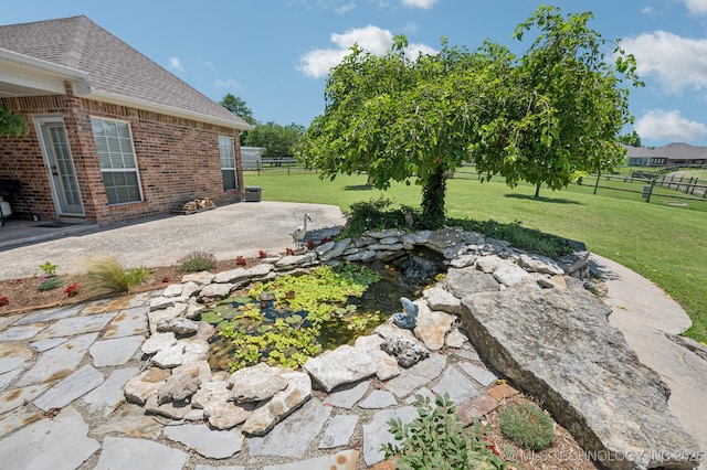 8402 N 100th E Ave, Owasso, OK 74055 - view of yard featuring a patio area and a small pond