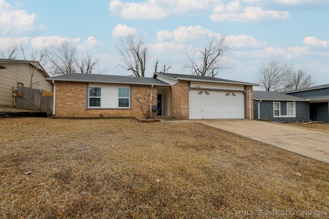 ranch-style home with a garage and a front yard