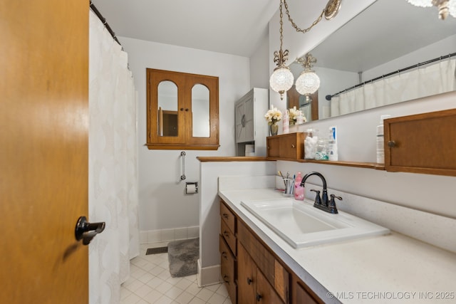 bathroom with vanity and tile patterned flooring