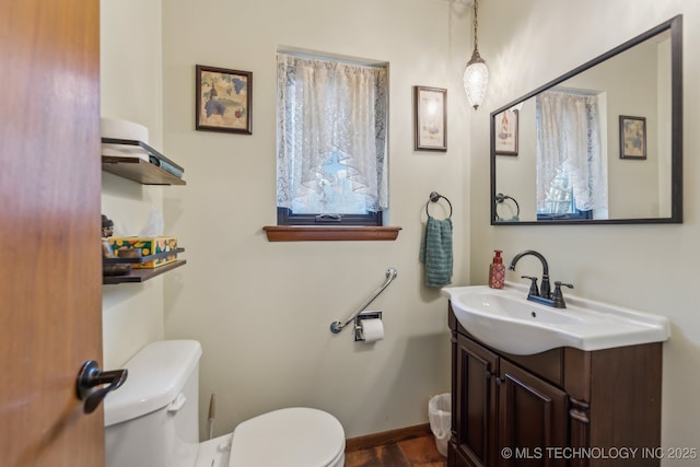 bathroom featuring vanity and toilet