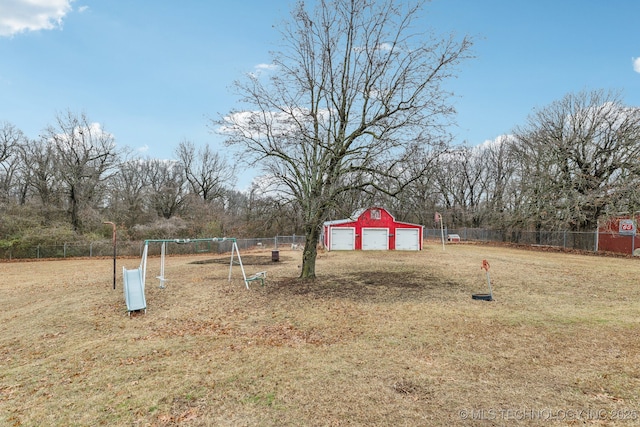 view of yard featuring an outbuilding and a garage