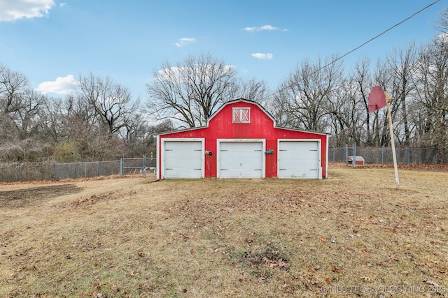 garage featuring a yard