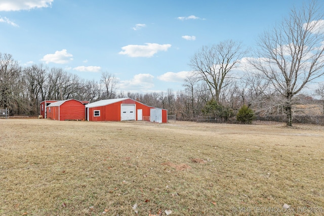 view of yard with an outbuilding and a garage