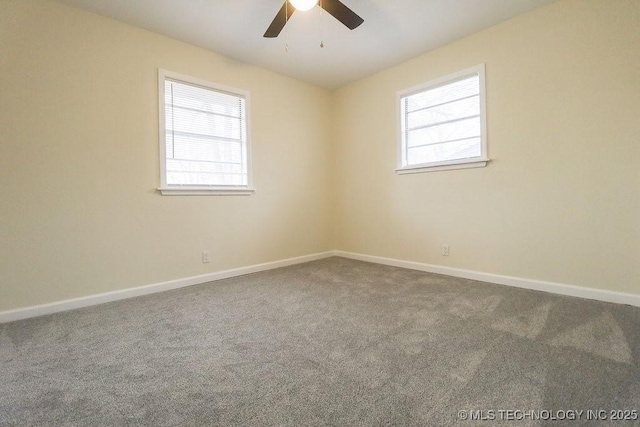 carpeted empty room featuring ceiling fan