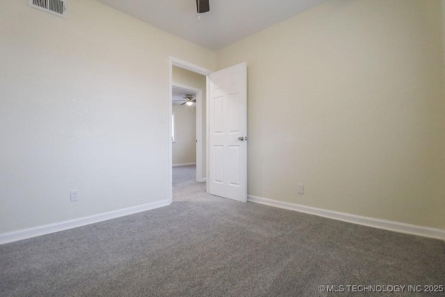 empty room with carpet and ceiling fan