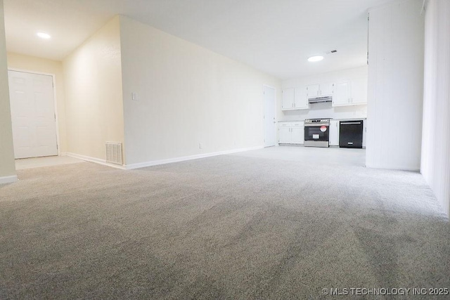 unfurnished living room featuring light colored carpet