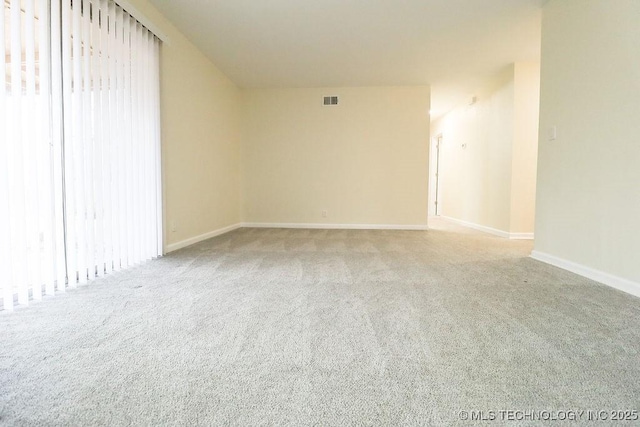 empty room featuring light colored carpet