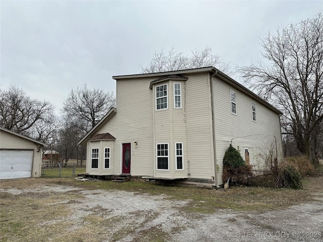 view of front of property with an outbuilding and a garage