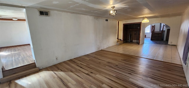 unfurnished room with light wood-type flooring