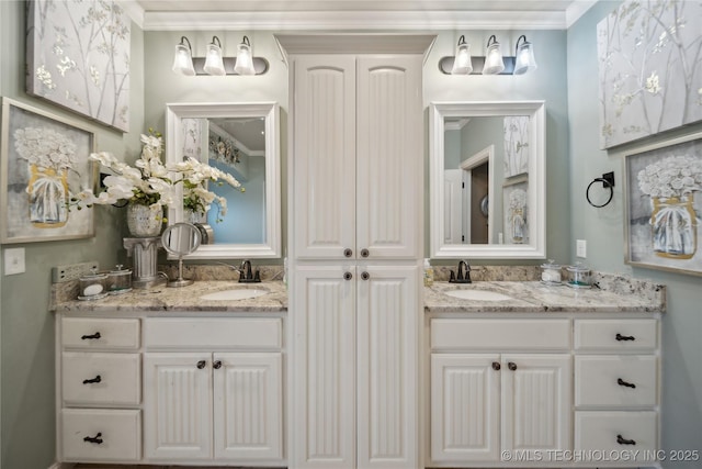 bathroom with vanity and ornamental molding