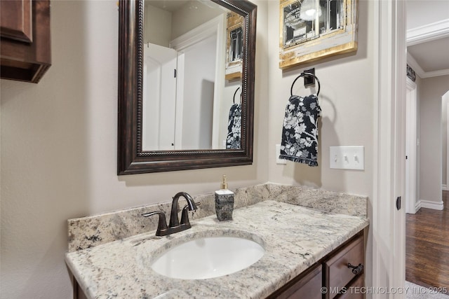 bathroom with vanity and hardwood / wood-style floors