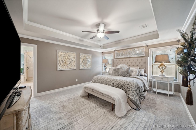 bedroom featuring a raised ceiling, crown molding, light colored carpet, and ceiling fan