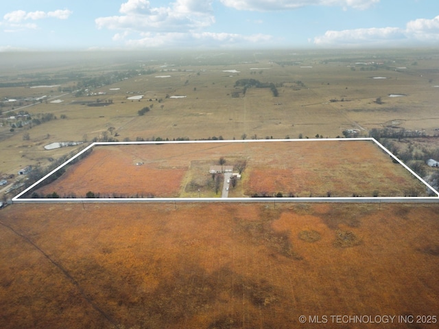 birds eye view of property with a rural view