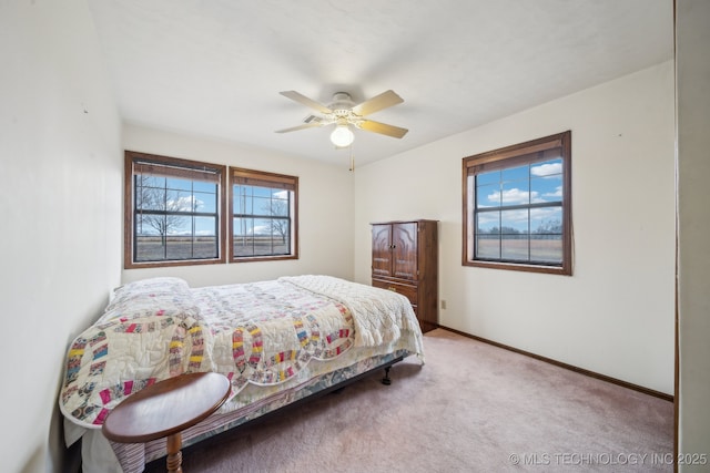 bedroom with light carpet and ceiling fan