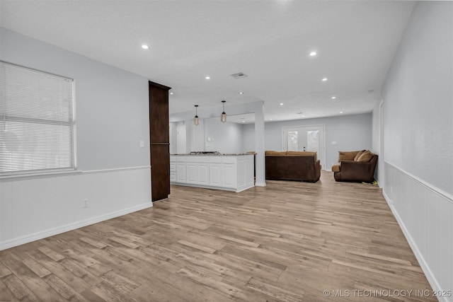 unfurnished living room featuring light hardwood / wood-style floors