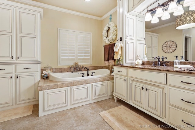 bathroom featuring vanity, a bathtub, ornamental molding, and tile patterned floors