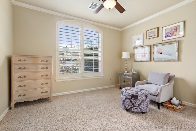 sitting room featuring crown molding, ceiling fan, and carpet floors