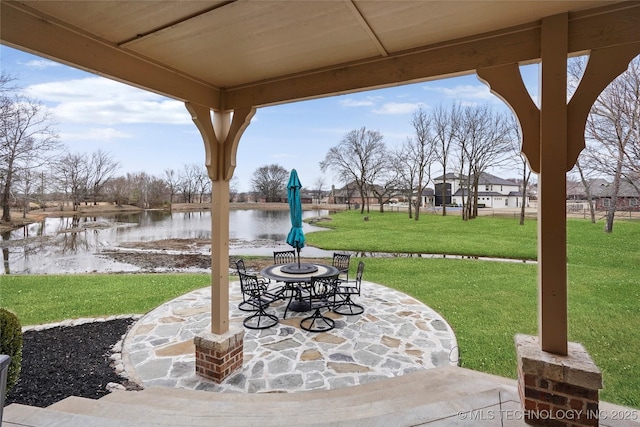 view of patio with a water view