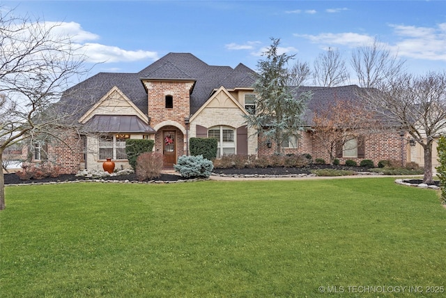 french country style house featuring a front yard