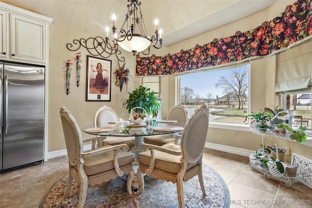 dining room featuring a notable chandelier