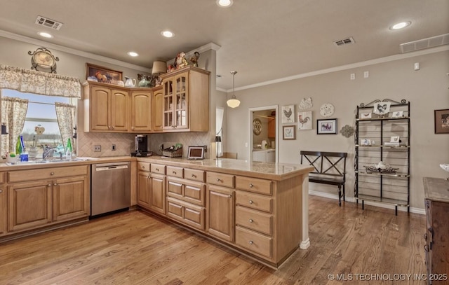 kitchen featuring tasteful backsplash, light hardwood / wood-style flooring, stainless steel dishwasher, ornamental molding, and pendant lighting