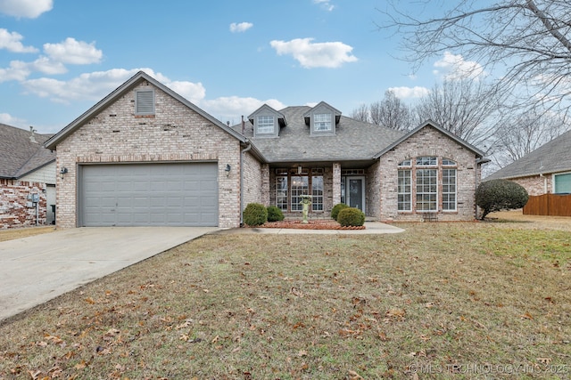 view of front of house featuring a garage and a front yard