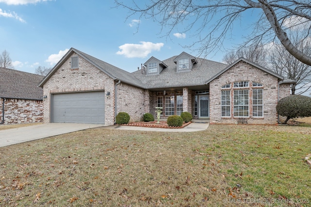 view of front of house with a garage and a front lawn