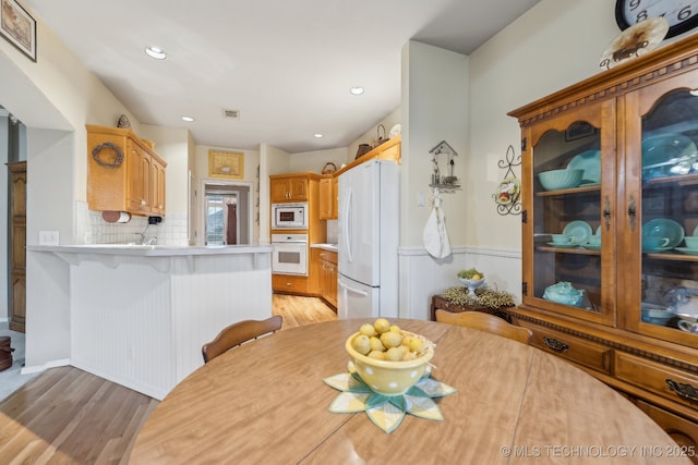 dining room featuring light hardwood / wood-style flooring