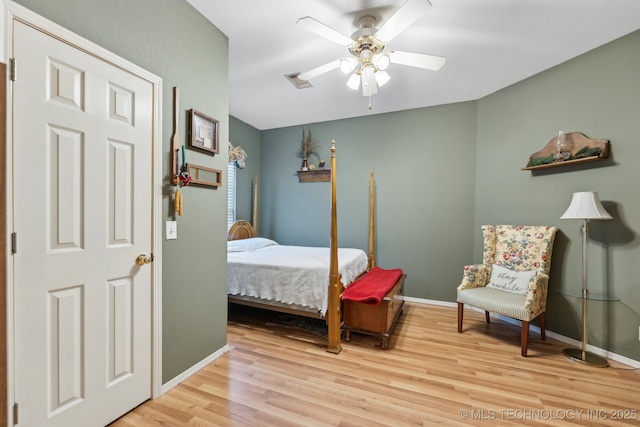 bedroom featuring ceiling fan and light hardwood / wood-style floors