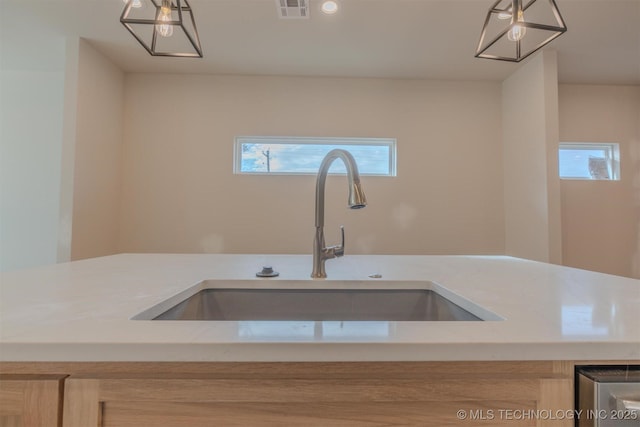 kitchen featuring sink, a wealth of natural light, and light brown cabinetry