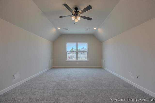 bonus room with ceiling fan, lofted ceiling, and light carpet