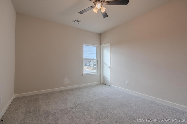 carpeted empty room featuring ceiling fan