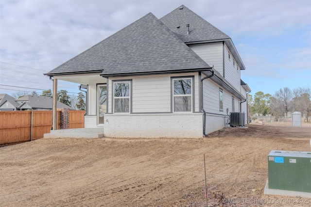 back of house with central AC