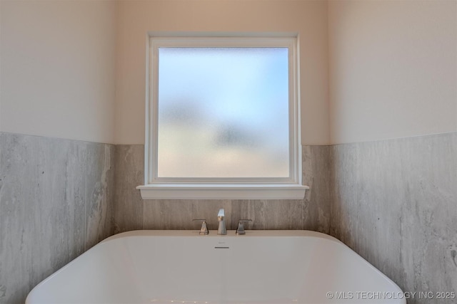 bathroom with a bathing tub