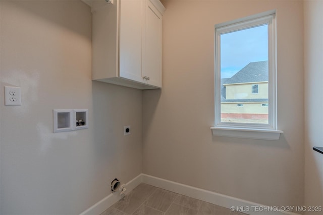 clothes washing area with electric dryer hookup, washer hookup, cabinets, and gas dryer hookup