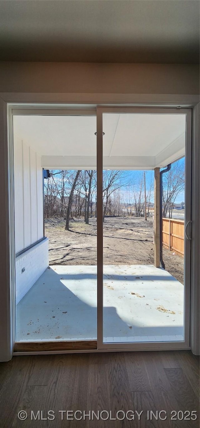 doorway to outside with wood finished floors