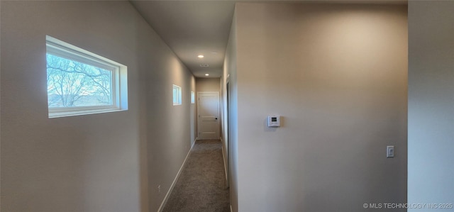 hall featuring carpet, baseboards, and recessed lighting