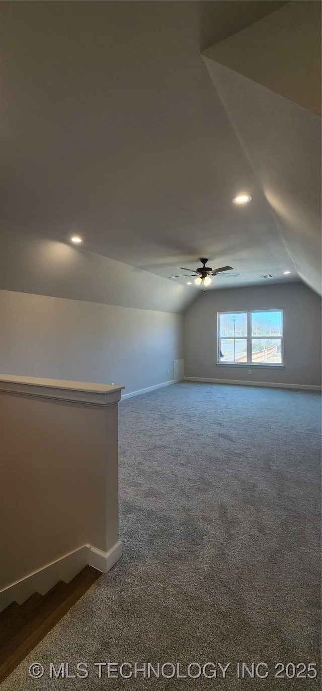 bonus room featuring lofted ceiling, a ceiling fan, baseboards, dark carpet, and recessed lighting