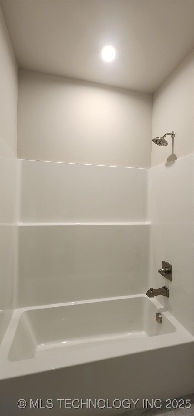 full bath with bathing tub / shower combination and recessed lighting