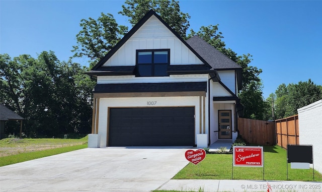 1007 E Delmar Pl, Broken Arrow, OK 74012 - view of front of house with board and batten siding, driveway, a garage, and roof with shingles