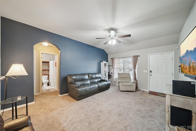 23260 Bessie Blvd, Claremore, OK 74019 - living area with ceiling fan, arched walkways, carpet flooring, vaulted ceiling, and baseboards