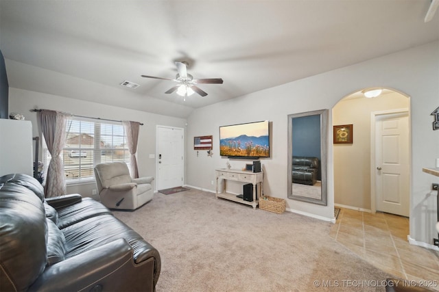 23260 Bessie Blvd, Claremore, OK 74019 - living room with arched walkways, ceiling fan, baseboards, and light colored carpet