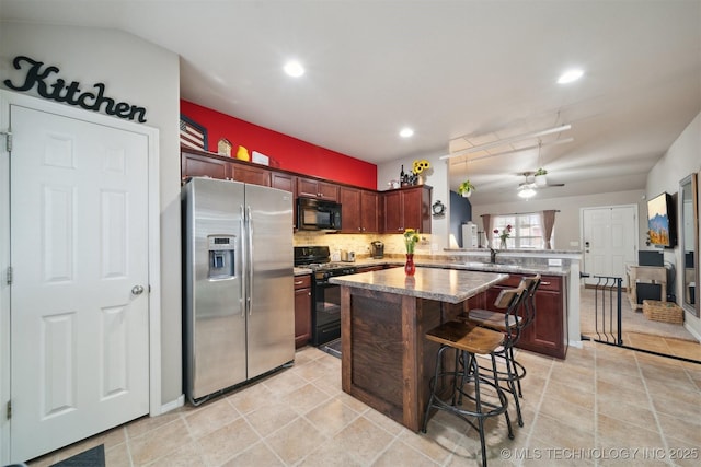 23260 Bessie Blvd, Claremore, OK 74019 - kitchen featuring black appliances, a peninsula, ceiling fan, tasteful backsplash, and recessed lighting
