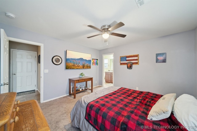 23260 Bessie Blvd, Claremore, OK 74019 - carpeted bedroom with baseboards, a ceiling fan, and ensuite bathroom