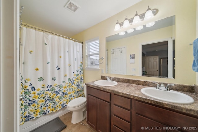 23260 Bessie Blvd, Claremore, OK 74019 - bathroom featuring tile patterned floors, double vanity, toilet, and a shower with curtain