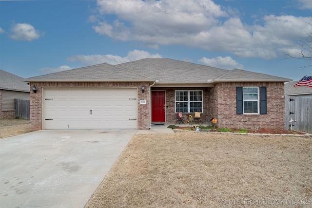 ranch-style home featuring a garage and a front yard