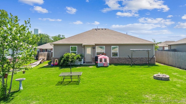 23260 Bessie Blvd, Claremore, OK 74019 - back of house featuring an outdoor fire pit and brick siding