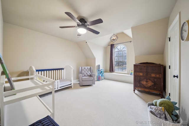 carpeted bedroom with vaulted ceiling and ceiling fan