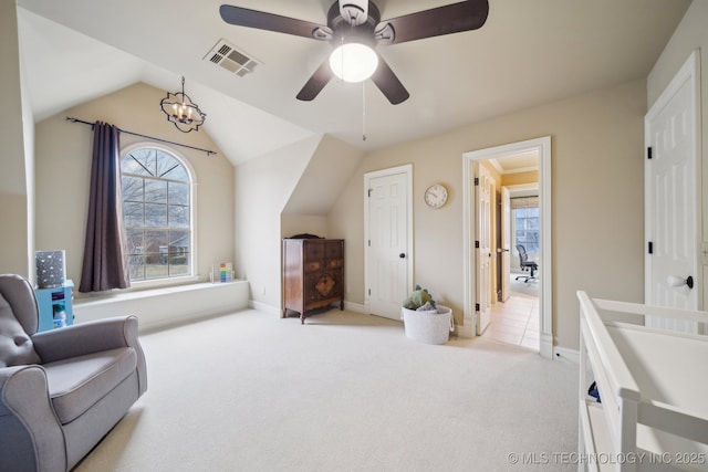 living area featuring lofted ceiling, a notable chandelier, and light colored carpet