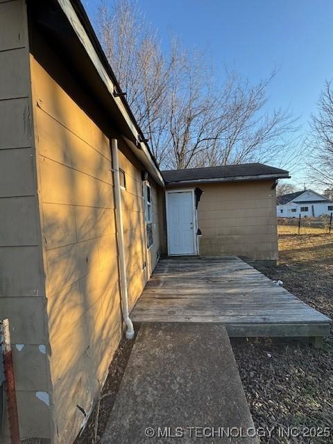 exterior space featuring a wooden deck